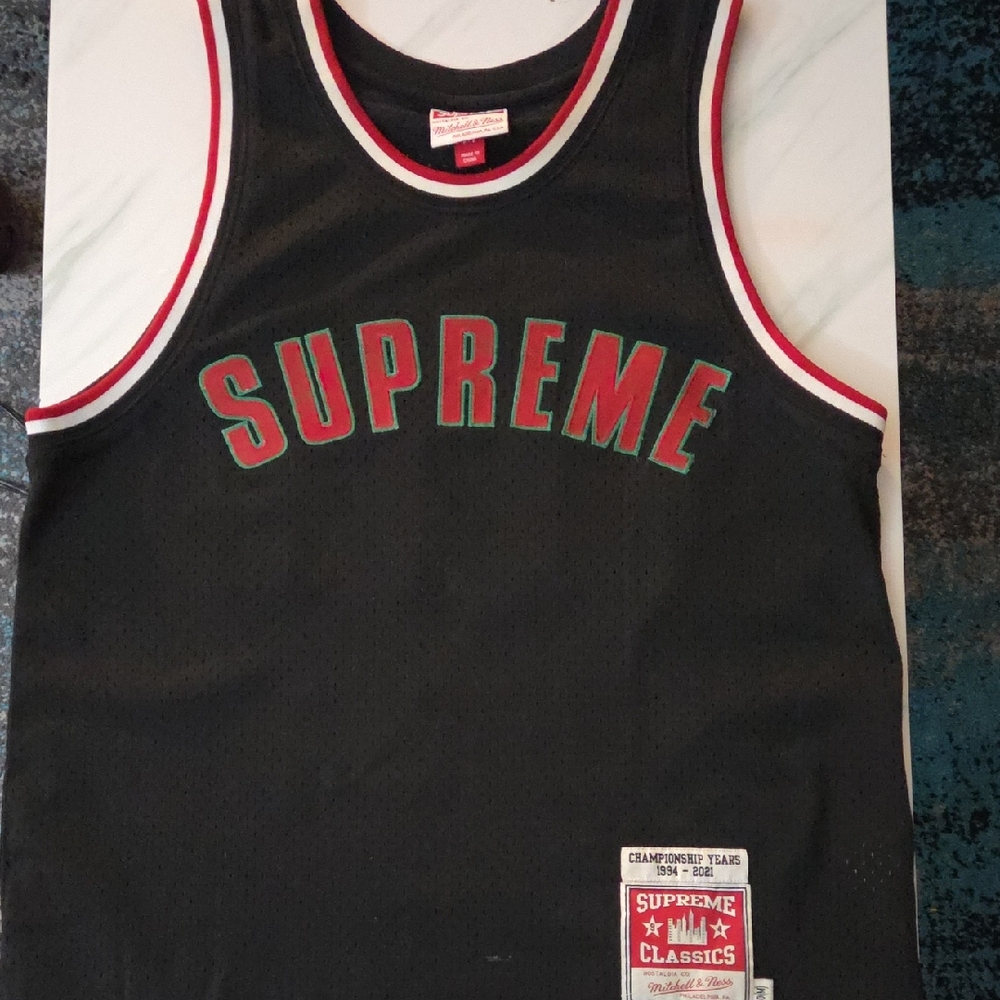 Supreme Black Jersey with Red and Green Accents